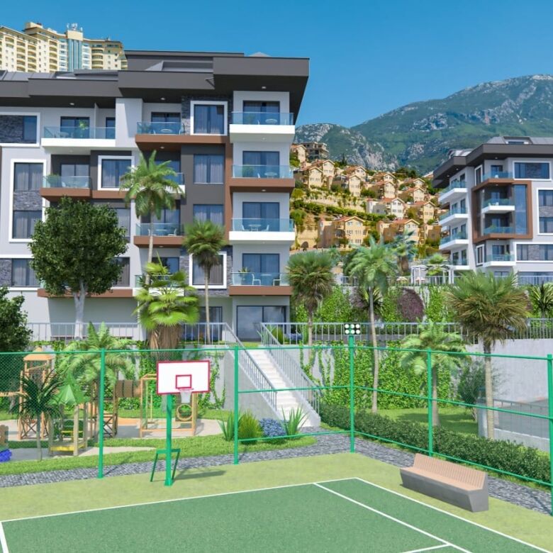 Sea-view luxury residences in Kargıcak, Alanya with modern amenities and scenic mountain backdrop.