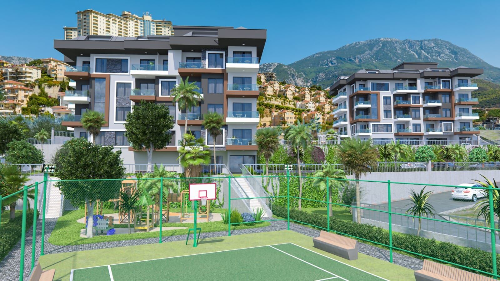 Sea-view luxury residences in Kargıcak, Alanya with modern amenities and scenic mountain backdrop.