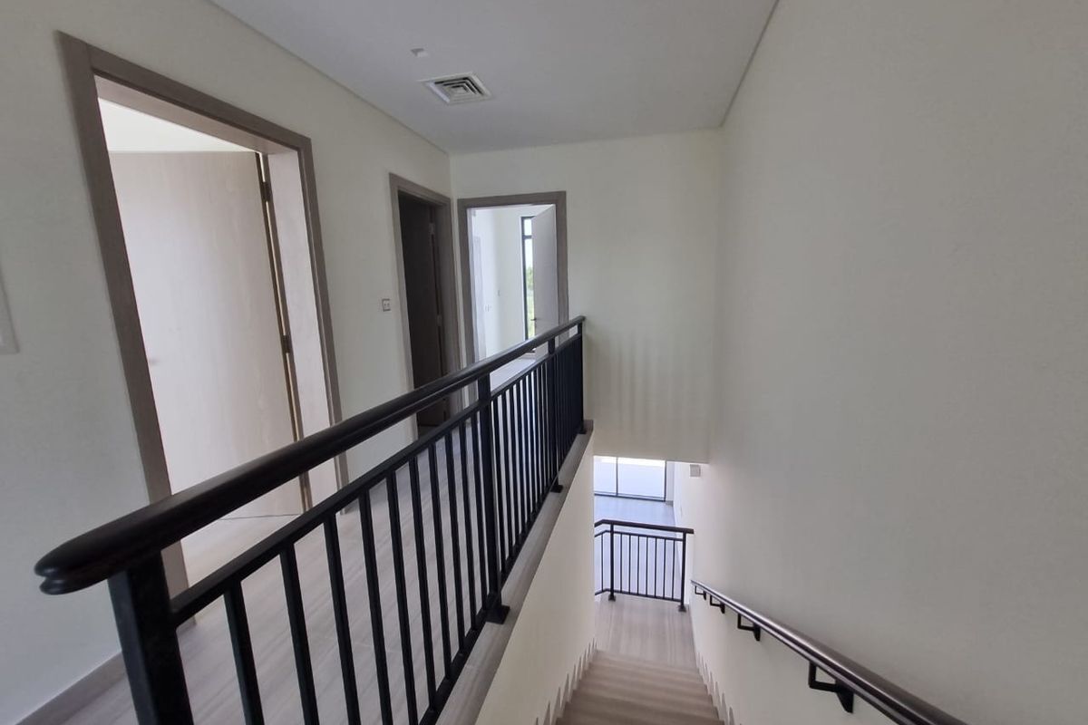 Scenic views from Dubai apartment staircase overlooking the city with balcony access and modern inte.