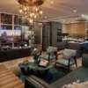 Elegant living room with modern decor and panoramic views of Tower Bridge in Wapping.