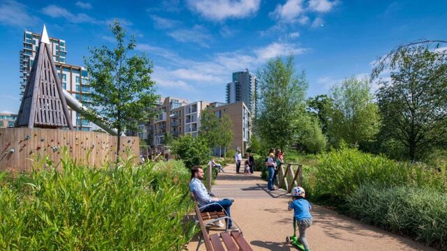 Modern park in Wandsworth, London, featuring greenery, walking paths, and city views.