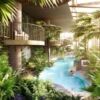 Elegant indoor pool surrounded by lush tropical plants and modern architecture in Wandsworth, London.