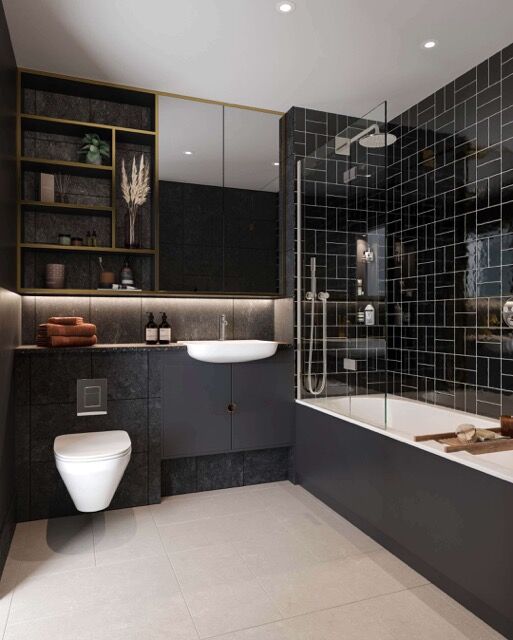 Stylish bathroom with black tiles, bathtub, and modern fixtures in a Plumstead apartment.