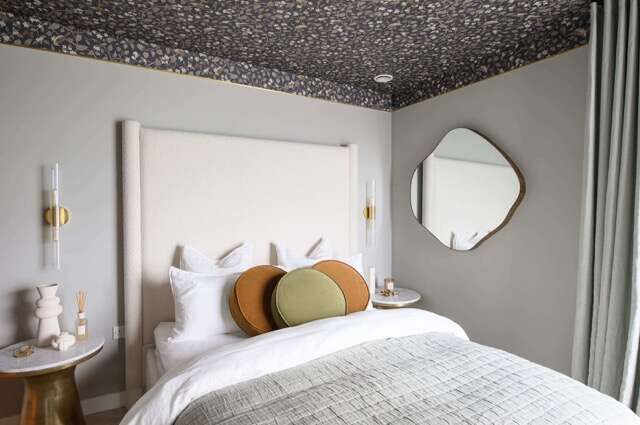 Modern bedroom with stylish decor and comfortable bedding in Woolwich, London.
