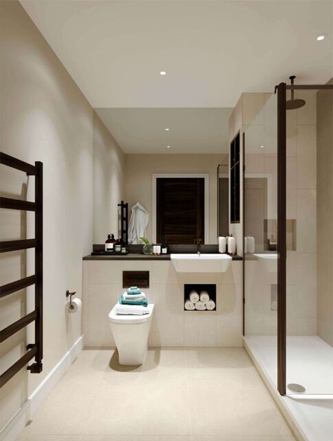 Luxurious bathroom in Birmingham featuring modern fixtures, a walk-in shower, and exclusive resident.