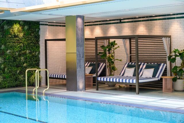 Luxurious outdoor pool area at a modern Fulham apartment in London.
