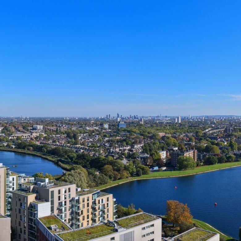 Panoramic view of a luxury property overlooking Wandsworth's green parks and river in London.