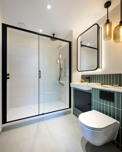Bright, contemporary bathroom with glass shower enclosure and stylish fixtures in Southall.