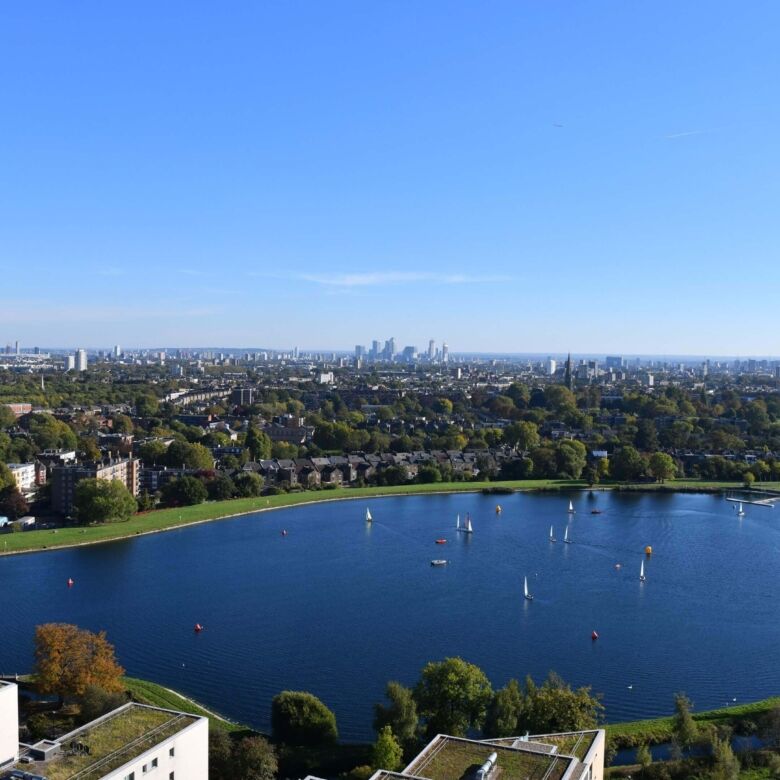 Beautiful view of Wandsworth's green spaces and lake with London skyline in the background.