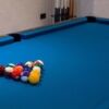 Pool table with balls in a contemporary apartment in Fulham, London.