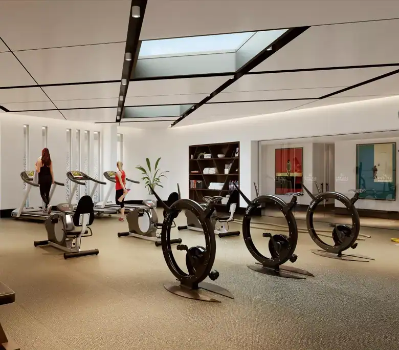 Modern gym with waterfront views in Chelsea luxury residences.