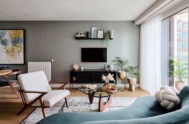 Spacious 2-bedroom apartment in Plumstead, London, featuring contemporary decor and large windows wi.