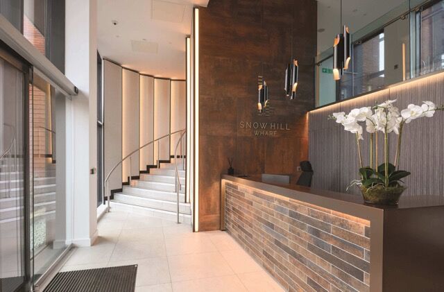 Contemporary apartment lobby with stylish decor and welcoming reception area.