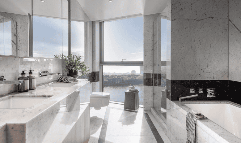 Modern Chelsea waterfront bathroom with panoramic city views and elegant marble finishes.