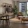 Stylish London apartment living room with modern furniture and large windows.