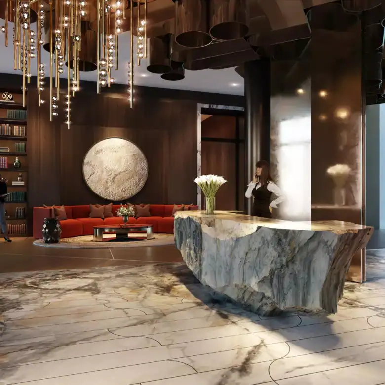 Elegant hotel lobby featuring a marble reception desk and modern decor in Chelsea, London.