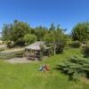 Rustic farmhouse surrounded by lush greenery in Pitignano, ideal for countryside living and investme.