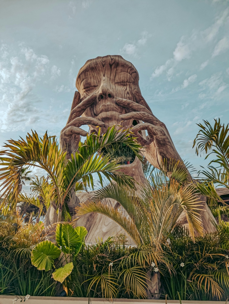 Sculpture of Person Holding Mask in Hands in San Jose del Cabo, Mexico