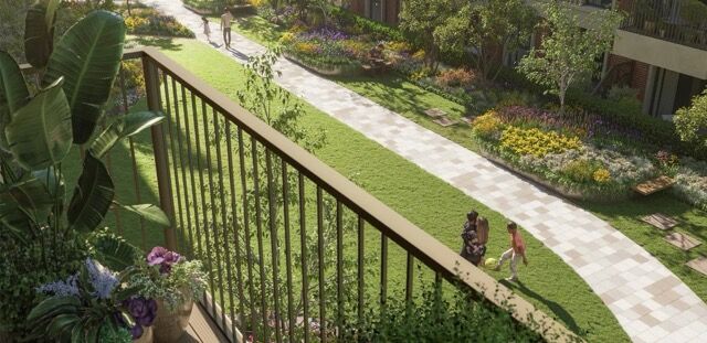Balcony view of lush garden and walking path at Hendon Homes, London.