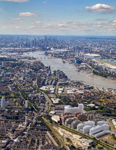 Aerial view of London showcasing the Thames River and city skyline.