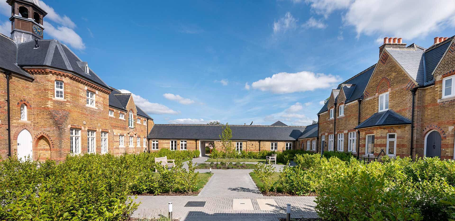 Regal Houses in Enfield with Historic Charm Elegant houses in Enfield showcasing royal architecture and historic surroundings.