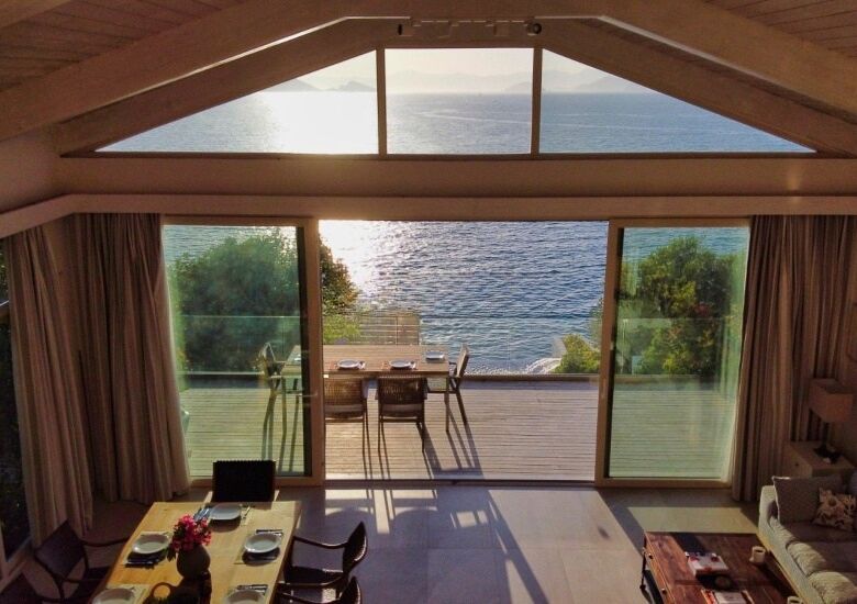 Seafront villa with private pier and stunning sea views on Sovalye Island, Fethiye, offering luxury.
