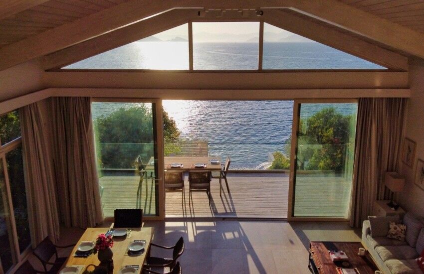 Seafront villa with private pier and stunning sea views on Sovalye Island, Fethiye, offering luxury.