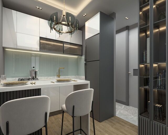 Contemporary kitchen in a luxury Mersin apartment with sea views and rich amenities.