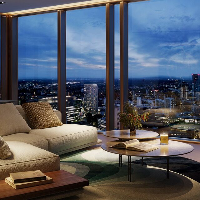 Modern luxury apartment with city views in Manchester at night.