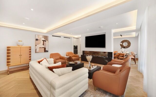 Elegant living room with contemporary furniture and stylish decor in Marylebone, London.