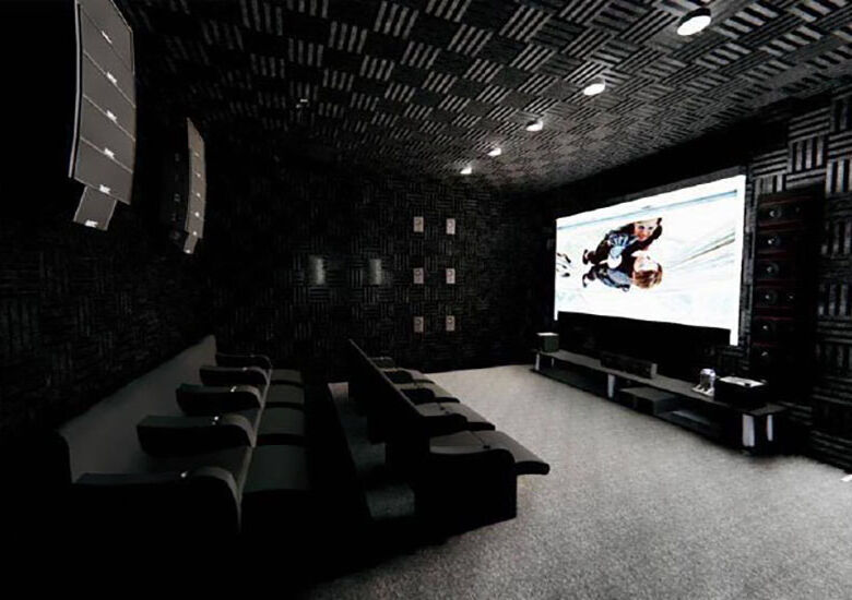 Home theater with large screen and surround sound system.