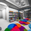 Bright indoor play area with vibrant rugs, toys, and seating for children.