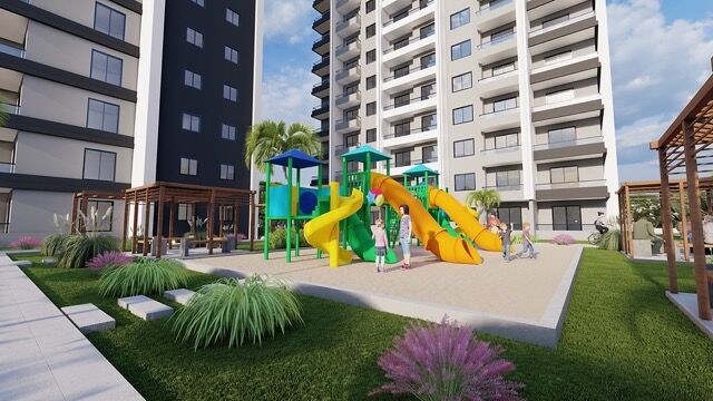 Brightly colored playground with slides and climbing structures in a residential area.