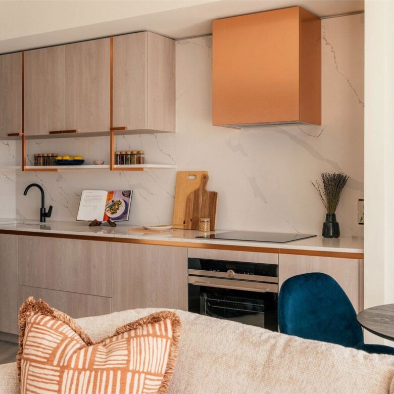 Modern kitchen in luxury Canary Wharf apartment with sleek cabinetry and contemporary design.