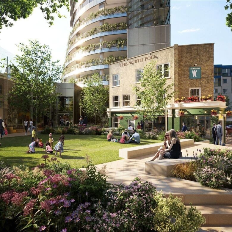 Modern park with lush greenery and seating areas in Canary Wharf.