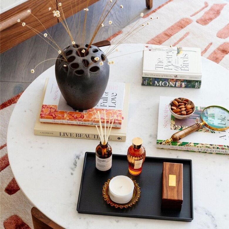 Elegant home decor with aromatic oils and decorative flowers for a luxurious ambiance.