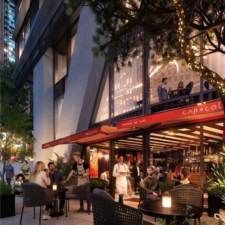 Elegant outdoor dining at Canary Wharf with modern architecture and vibrant city lights.