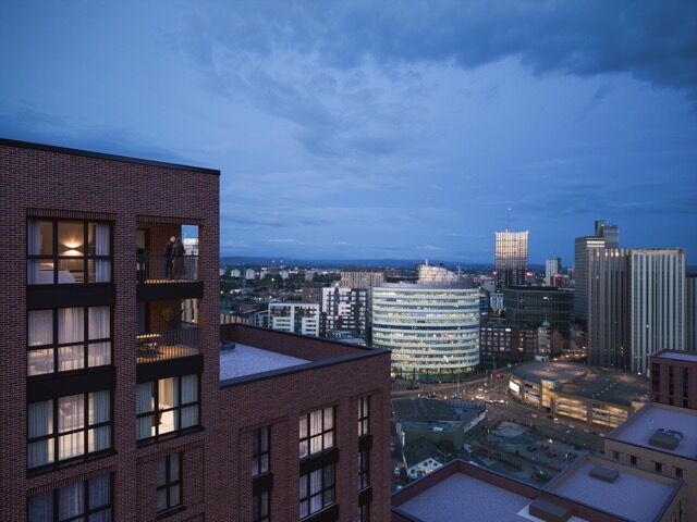 Modern 13th-floor apartment in Manchester with stunning south-west city views at sunset.