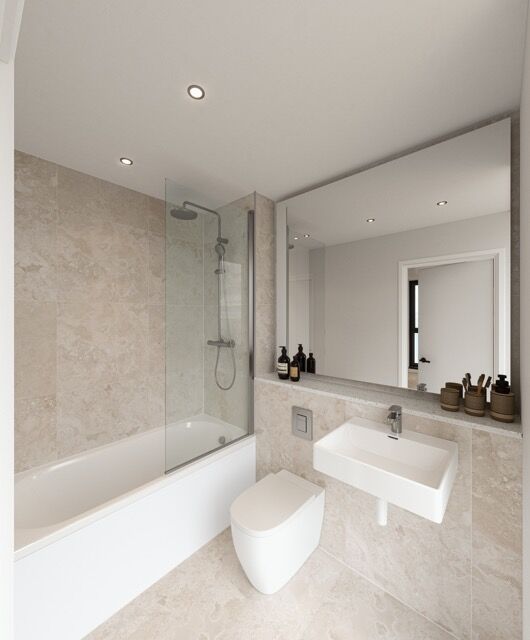 Modern bathroom in luxury Manchester apartment with east-facing windows.
