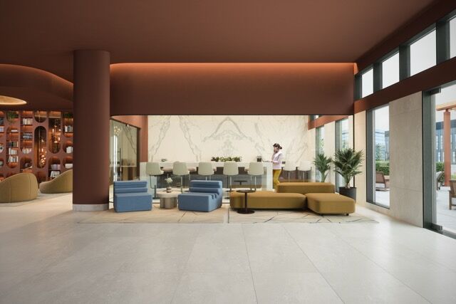 Elegant hotel lobby with contemporary furniture and natural light.