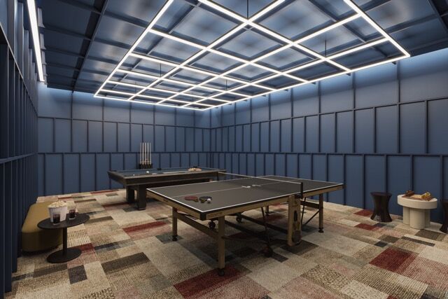 Modern indoor ping pong room with stylish lighting and decor in Manchester apartment.