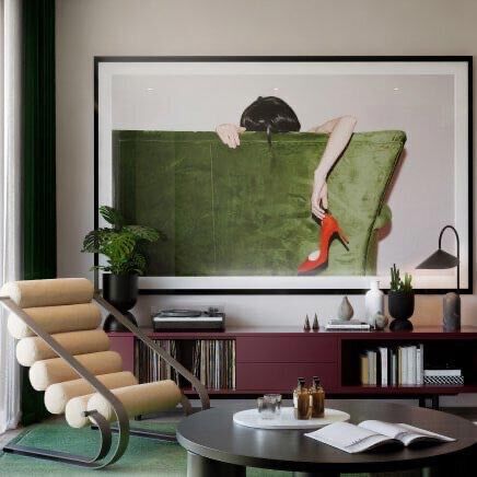 Elegant interior with a large artwork and stylish furniture in a riverside home.