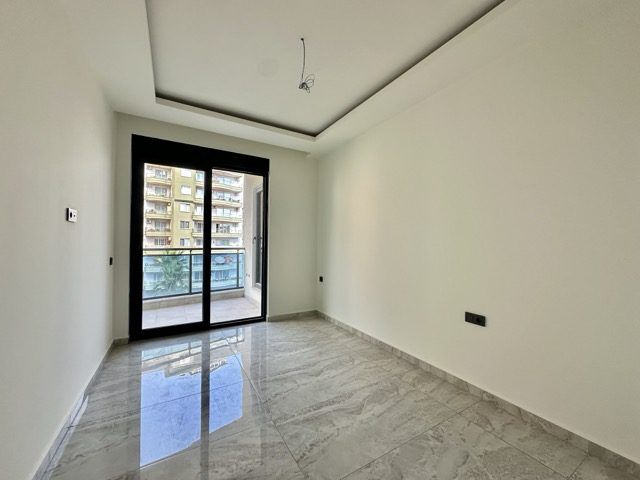 Bright interior of a modern 2+1 apartment near the sea in Alanya Guller Pınarı.