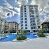 Apartment with pool, balcony, and modern design in a stylish residential complex.