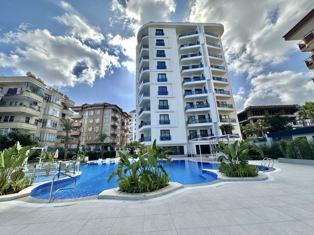 Modern 1+1 apartment with pool and balcony in Prime Gullerpınarı, Alanya.