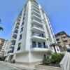 Modern 1+1 apartment with pool and balcony in Alanya, prime Gullerpınarı location.