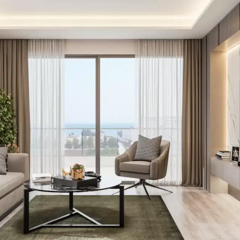 Sea and city view living room with large windows in Erdemli Mersin apartment.