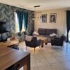 Impeccable villa interior with modern furniture, stylish decor, and bright natural light.