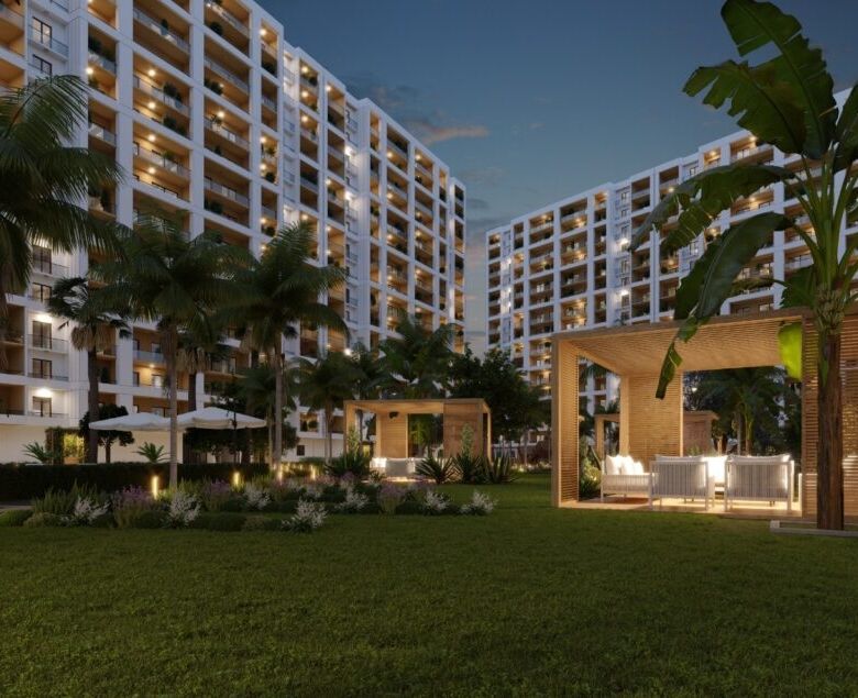 Modern residential complex with outdoor lounge area and lush landscaping in Mersin.