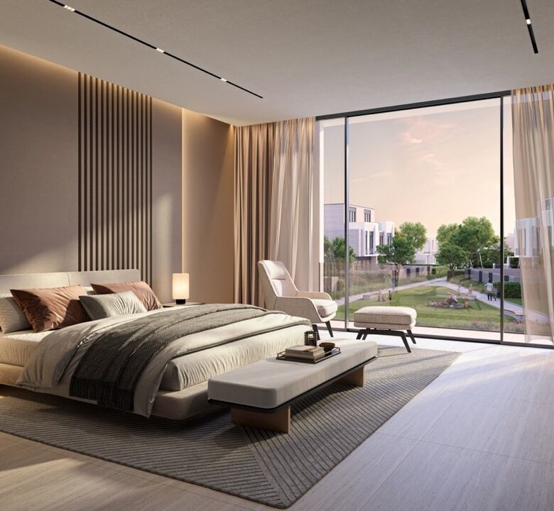 Modern bedroom with large window view of Dubai golf course and lush greenery.